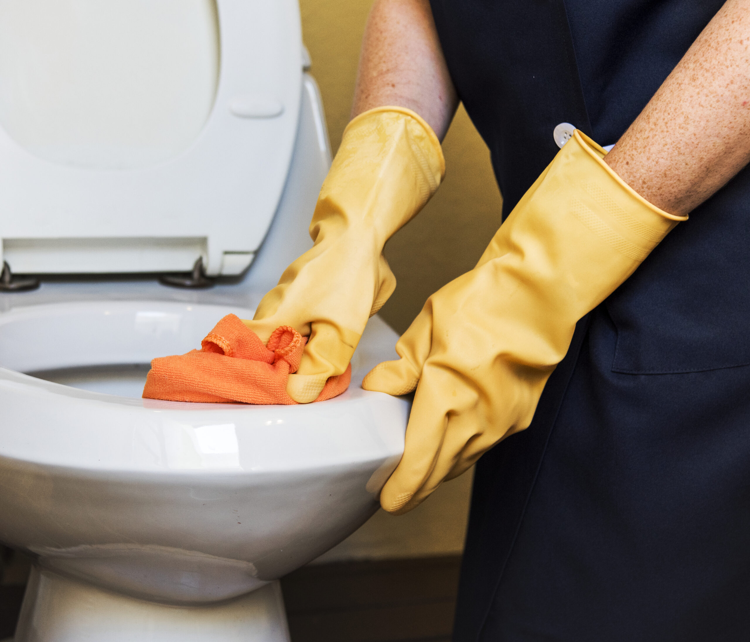 Housekeeper cleaning a hotel room